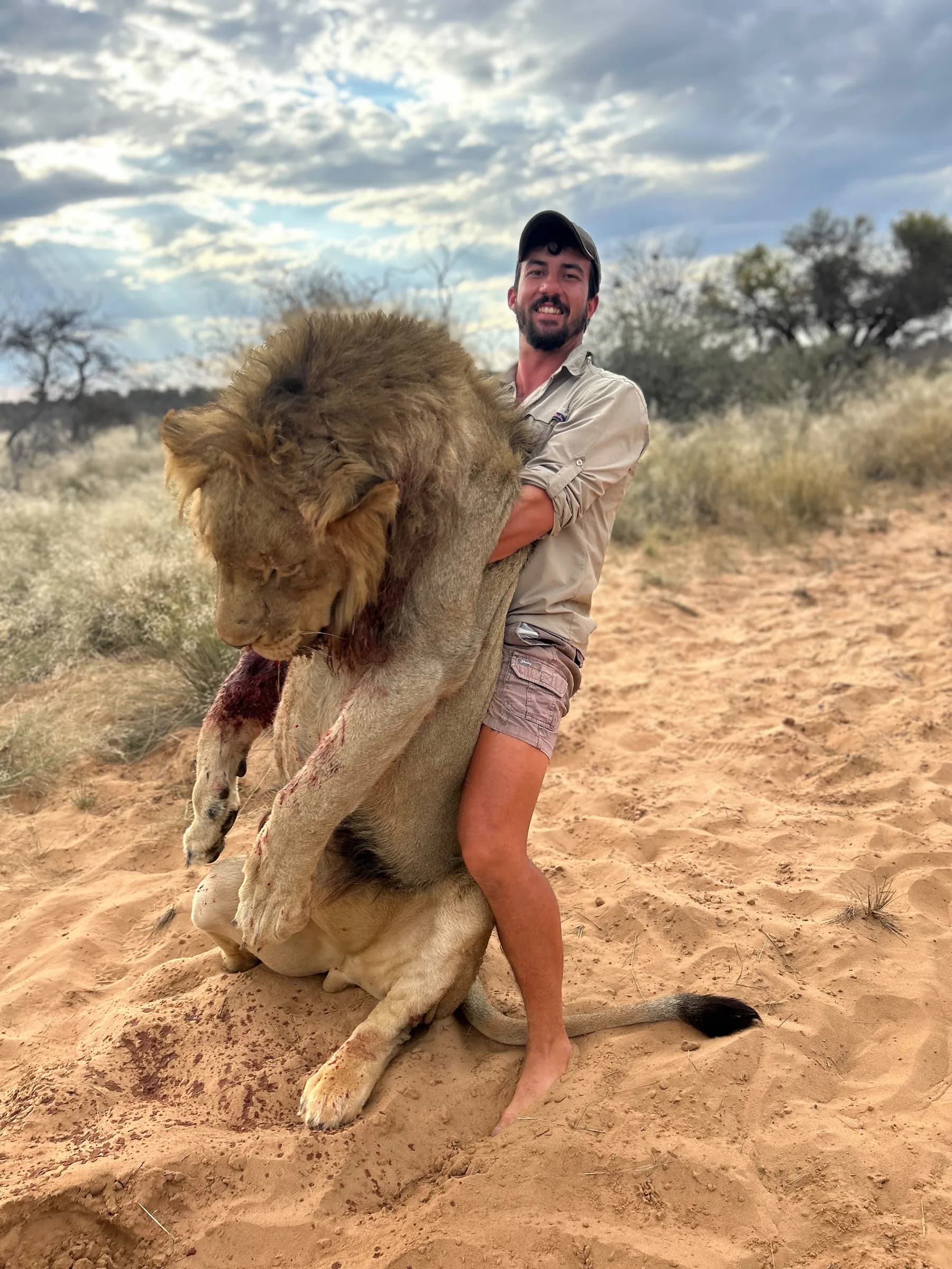 A hunter with a free-range lion taken on an allocated permit